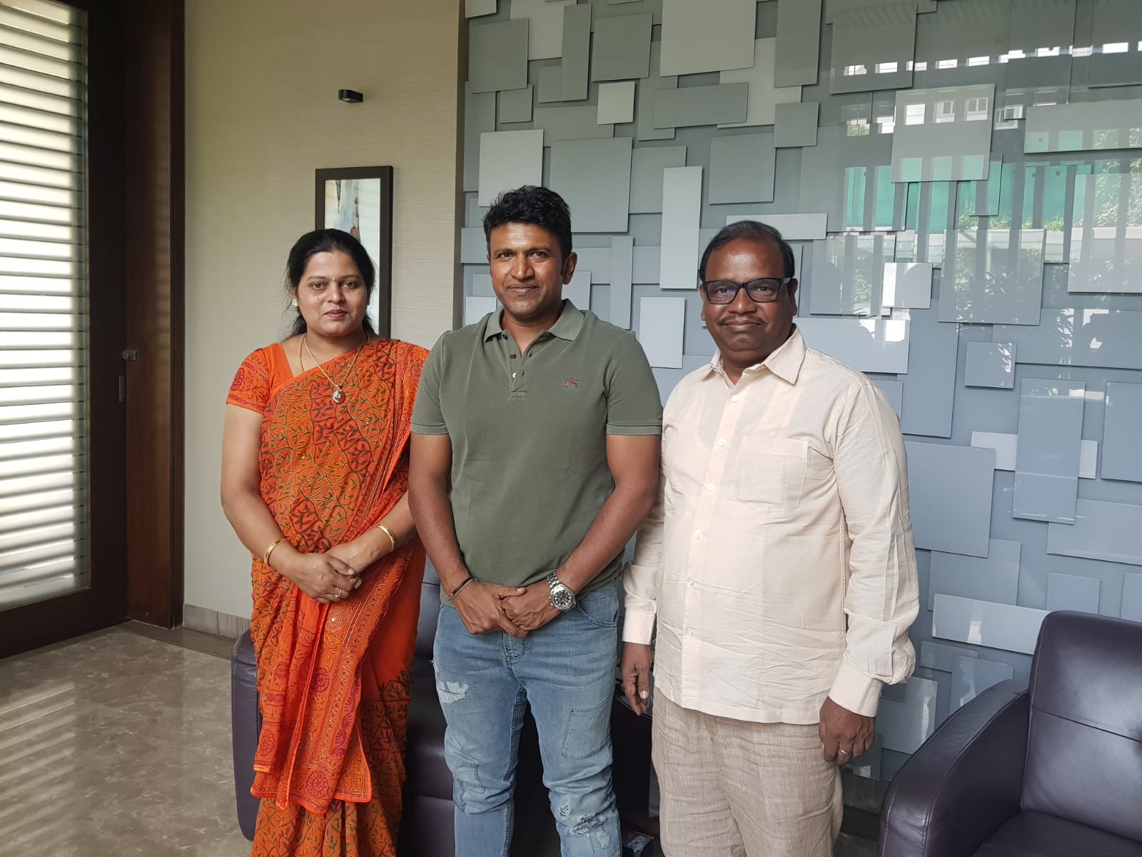 Mallikaarjun Bhupalam and his wife with the late Kannada actor Puneeth Rajkumar